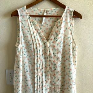 Floral sleeveless button up top
